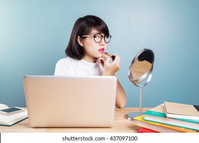 Young Asian Women Make Up With Workspace Table