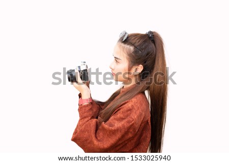 Young asian women photographer smart and looks cool with vintage camera on isolated background