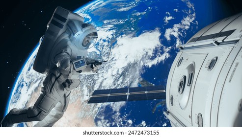 Young Astronaut Floating in Space in Zero Gravity. Spaceman Using Laptop Computer in Open Space Outside an Orbiting Spacecraft, Browsing Instruction Manuals for Maintenance Work on a Satellite - Powered by Shutterstock