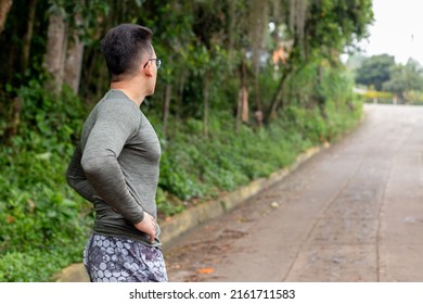 Young Athlete Prepares Mentally For The Sport. Person Looking At The Road Ahead. Healthy Lifestyle Concept. Health And Wellness Close To Nature.