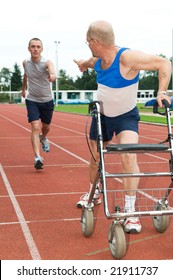 Young Athlete Reaching For A Disabled Athlete To Pass Him The Baton. Caricature Picture To Illustrate Helping, Giving, Disability, Ability, Getting Older, Not Wanna Quit.