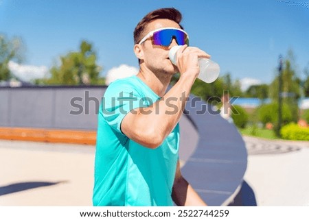 Image, Stock Photo Young athlete refreshes himself with water after a hard workout on the athletic oval in the intense heat. Endurance training. Brown-haired adolescent