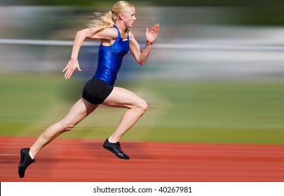 Young Athlete Running Down The Track With Motion Blur Added