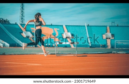 A young athlete sprints in a stadium