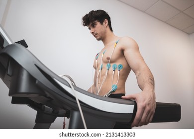 A Young Athlete Undergoes A Stress Test On A Treadmill.It Measures The Activity Of The Heart With An Electrocardiogram.