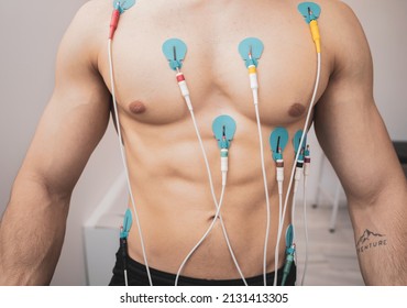 A Young Athlete Undergoes A Stress Test On A Treadmill.It Measures The Activity Of The Heart With An Electrocardiogram.