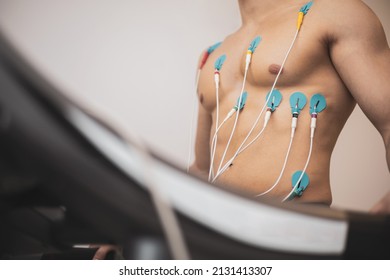 A Young Athlete Undergoes A Stress Test On A Treadmill.It Measures The Activity Of The Heart With An Electrocardiogram.