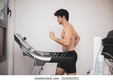 A young athlete undergoes a stress test on a treadmill.It measures the activity of the heart with an electrocardiogram.