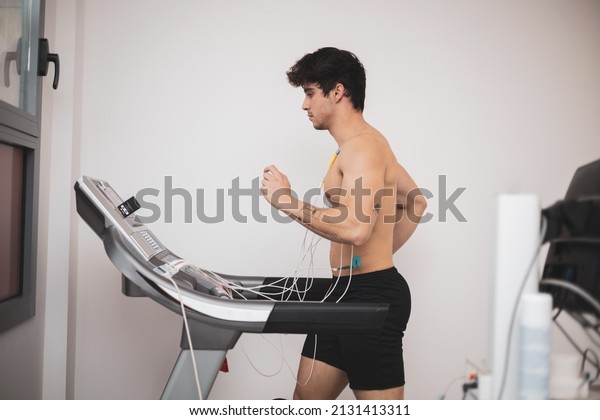 A\
young athlete undergoes a stress test on a treadmill.It measures\
the activity of the heart with an\
electrocardiogram.
