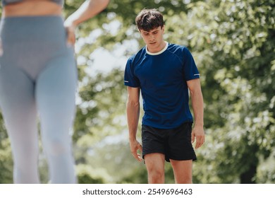 Young athletes cooling down after an intense workout session in an outdoor park, showcasing fitness and healthy lifestyle. - Powered by Shutterstock