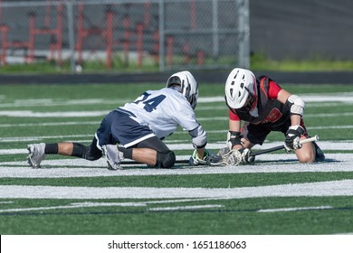 Young Athletes Making Amazing Plays While Playing In A Lacrosse Game
