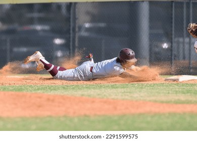 Young athletic boys playing in a competitive game of baseball - Powered by Shutterstock