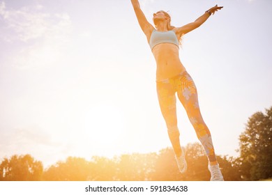 Young athletic girl playing with flying disc in the park. Professional player. Sport concept - Powered by Shutterstock