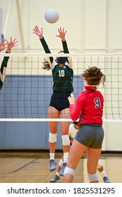 Young athletic girl playing in a volleyball match