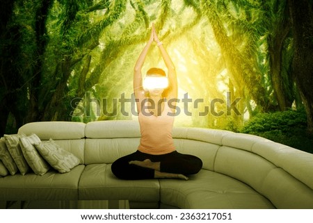 Young Athletic Indian Woman Wearing Virtual Reality Headset, meditating in Modern Futuristic Way