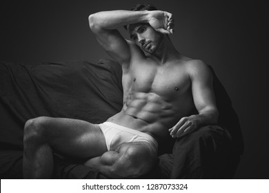 Young Athletic Male In Underwear Posing On Camera.