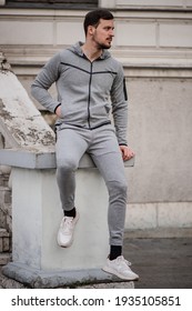 Young athletic male wearing sports clothing tracksuit in different positions and different colors - Shutterstock ID 1935105851