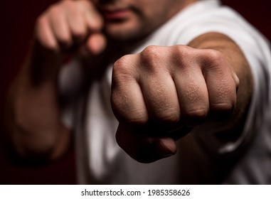 A Young, Athletic Man In A Boxing Position Performing A Hit 