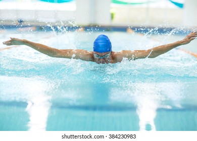 Young Athletic Man With Butterfly Swimming Technique