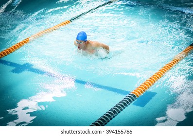 Young Athletic Man With Butterfly Swimming Technique