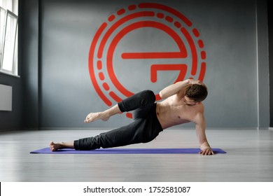 Young, Athletic Man Is Doing Exercise 