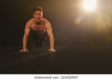 Young Athletic Man Doing Push-ups. Muscular And Strong Guy Exercising , Sport Man