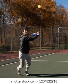 Young Athletic Man Playing Pickleball