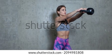 Similar – Image, Stock Photo One young athletic woman at crossfit training, exercising with trx suspension fitness straps over dark background, front view, looking at camera