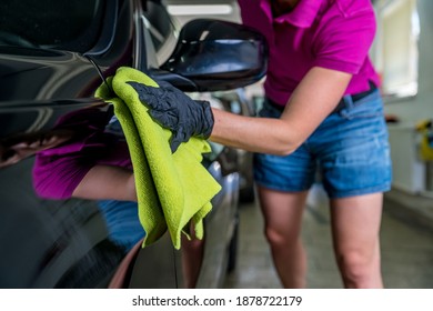 Young Atractive Woman Polishing Car Body In Service