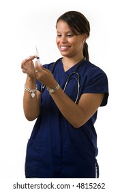 Young Attractive African American  Woman Healthcare Worker Wearing Dark Blue Scrubs And A Stethoscope Holding And Looking At A Syringe With A Friendly Smile