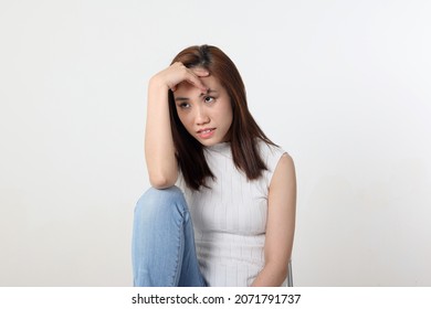 Young Attractive Asian Chinese Malay Woman Pose Face Body Expression Mode Emotion On White Background Think Worry Sitting Legs Up