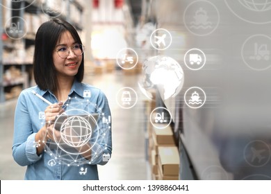 Young attractive asian manager woman looking, picking, replemishment, receiving inventory at store warehouse in warehouse management system concept. Smart ERP with iot for inventory management.
