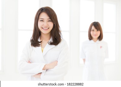 Young Attractive Asian Nurse And Doctor