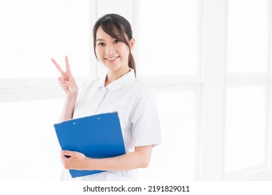 Young Attractive Asian Nurse Of The Smile,Medical Questionnaire