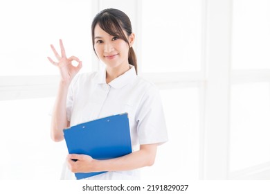 Young Attractive Asian Nurse Of The Smile,Medical Questionnaire