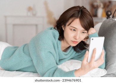 young attractive asian woman ,　think - Shutterstock ID 2394676901