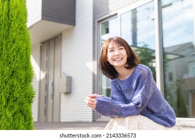 young attractive asian woman , entrance - Powered by Shutterstock