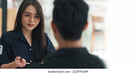 Young Attractive Asian Woman With Glasses During Job Interview.