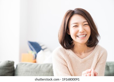 young attractive asian woman relaxing - Shutterstock ID 1916800091