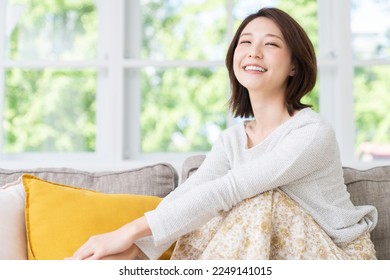 young attractive asian woman relaxing - Shutterstock ID 2249141015