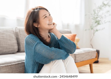 young attractive asian woman relaxing - Powered by Shutterstock