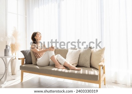 young attractive asian woman relaxing,