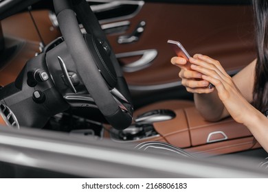 Young Attractive Asian Woman Using Phone While Sitting In A Luxury Car Front Sea