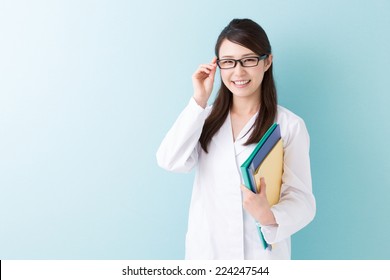 Young Attractive Asian Woman In A White Coat