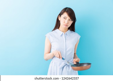 young attractive asian woman who cooks,trouble