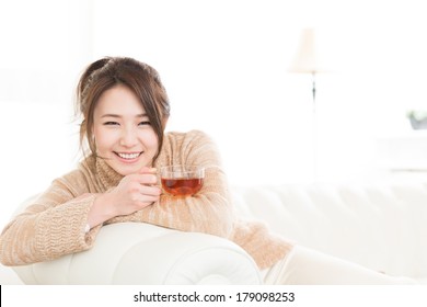 Young Attractive Asian Woman Who Drink Tea