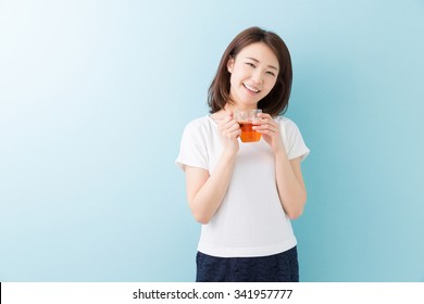 Young Attractive Asian Woman Who Drink Tea