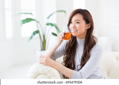 Young Attractive Asian Woman Who Drink Tea