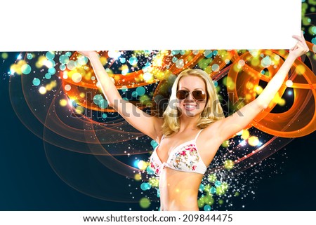 Young attractive blond in bikini holding blank banner