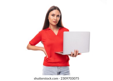 young attractive brunette woman in red stylish v-neck blouse holding laptop for studying remotely
